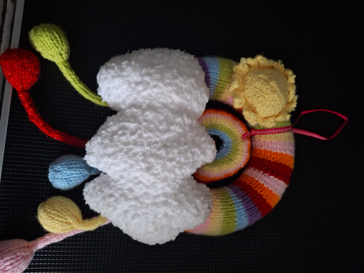 Rainbow and clouds wreath knitted