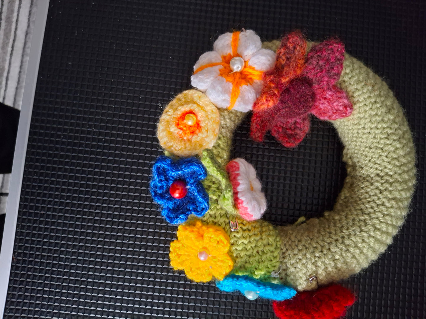 Floral knitted and crocheted wreath