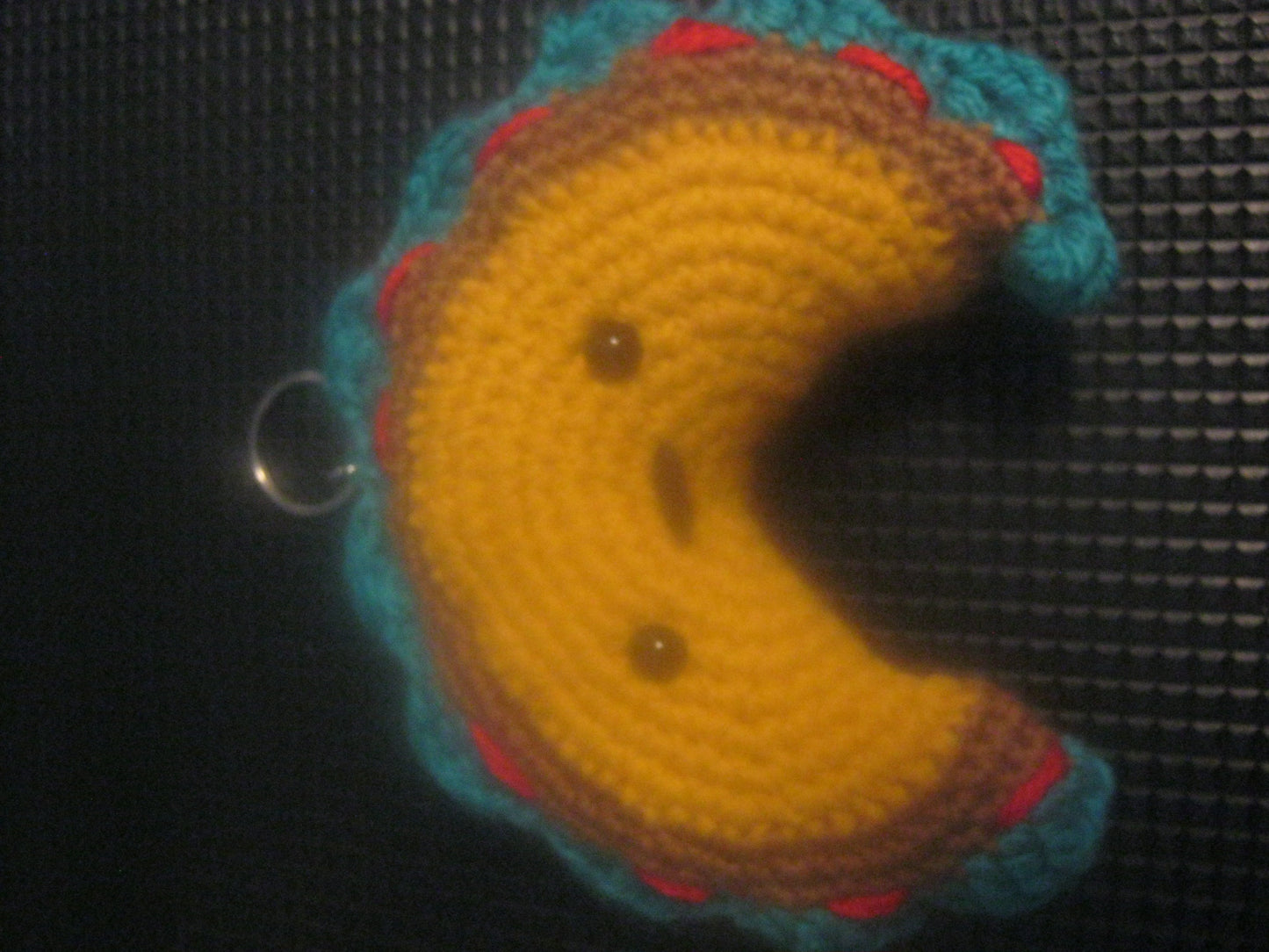 assortment of keyrings that are knitted or crocheted