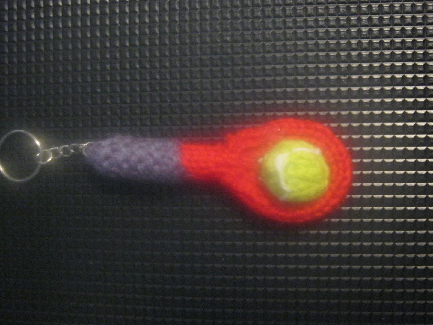 assortment of keyrings that are knitted or crocheted
