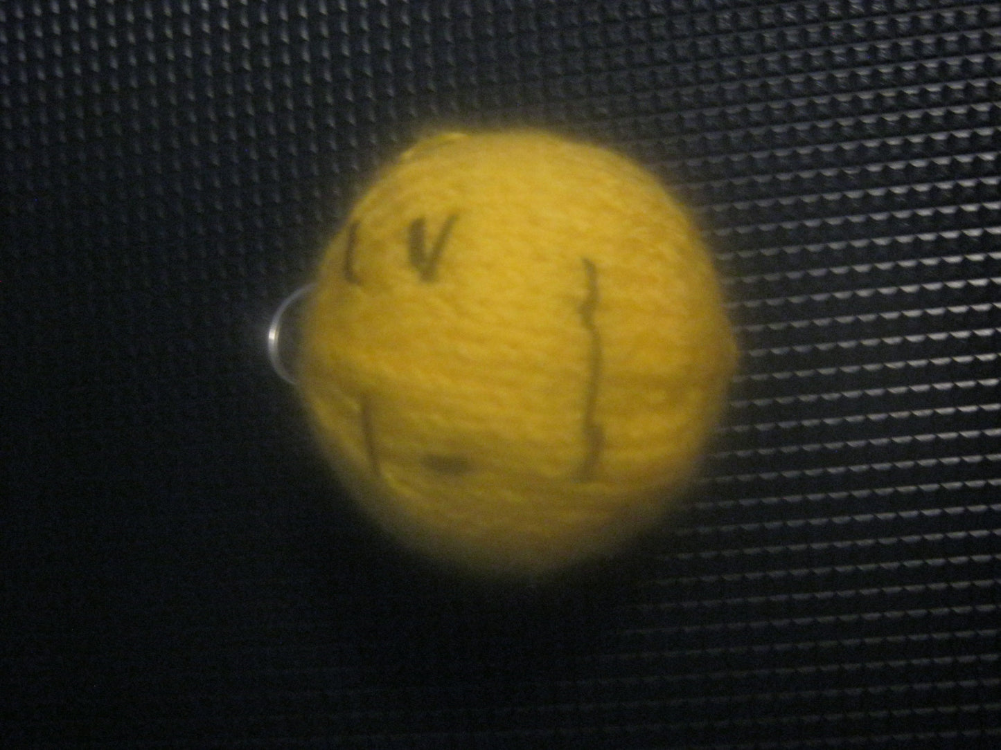 assortment of keyrings that are knitted or crocheted