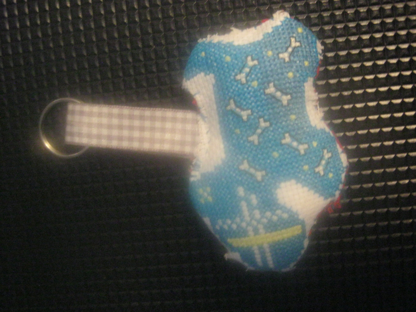 assortment of keyrings that are knitted or crocheted