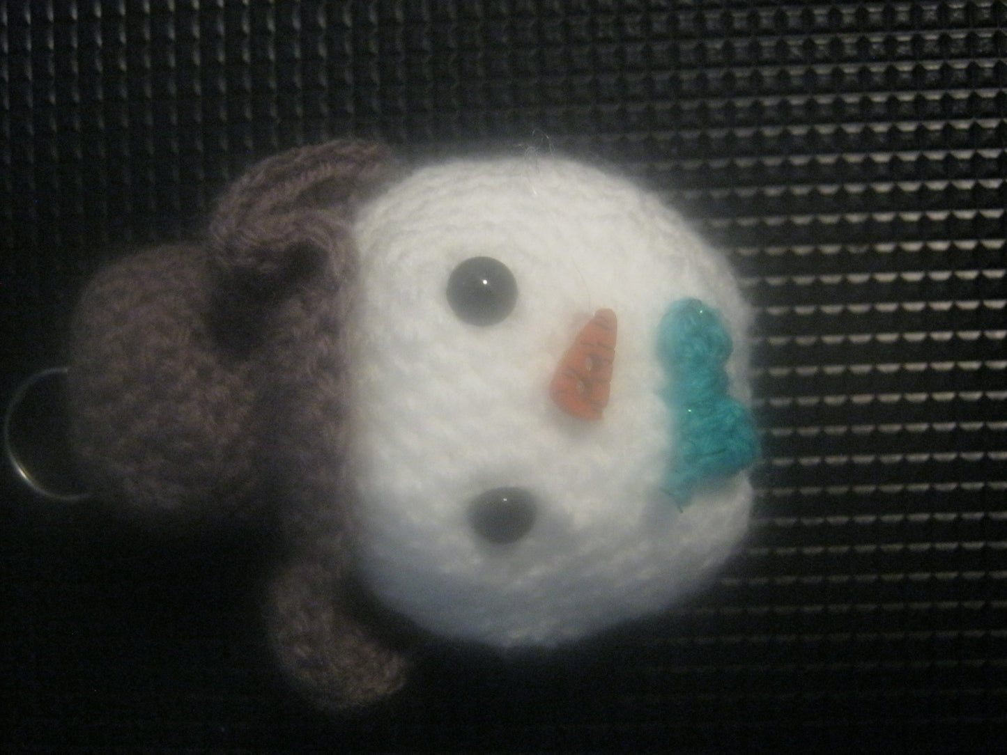 assortment of keyrings that are knitted or crocheted