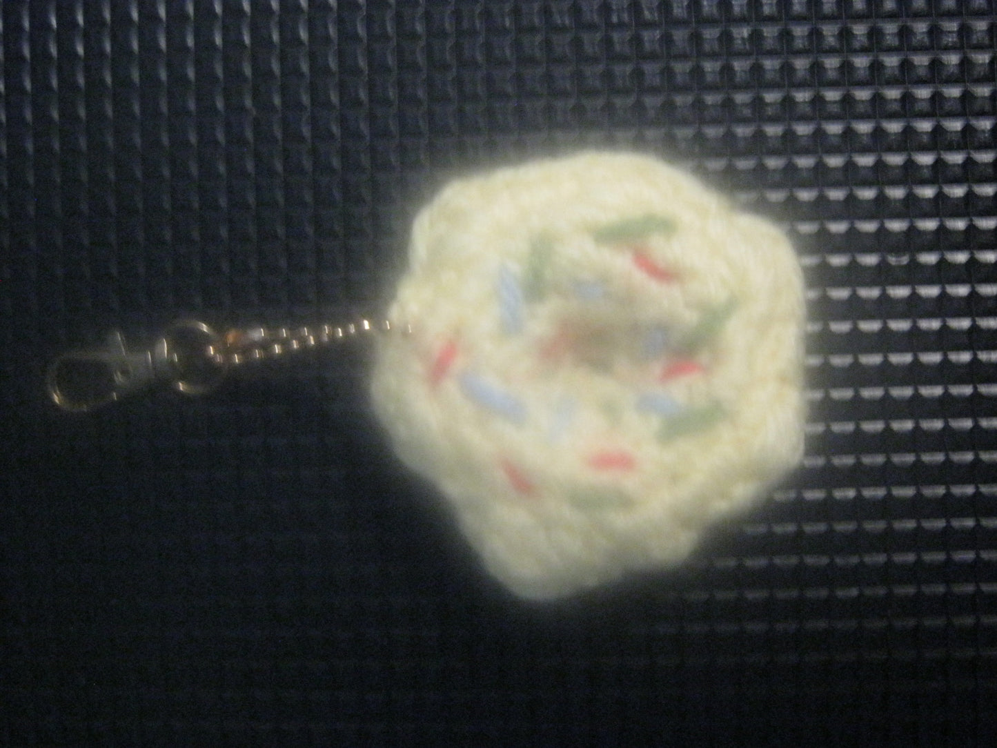 assortment of keyrings that are knitted or crocheted