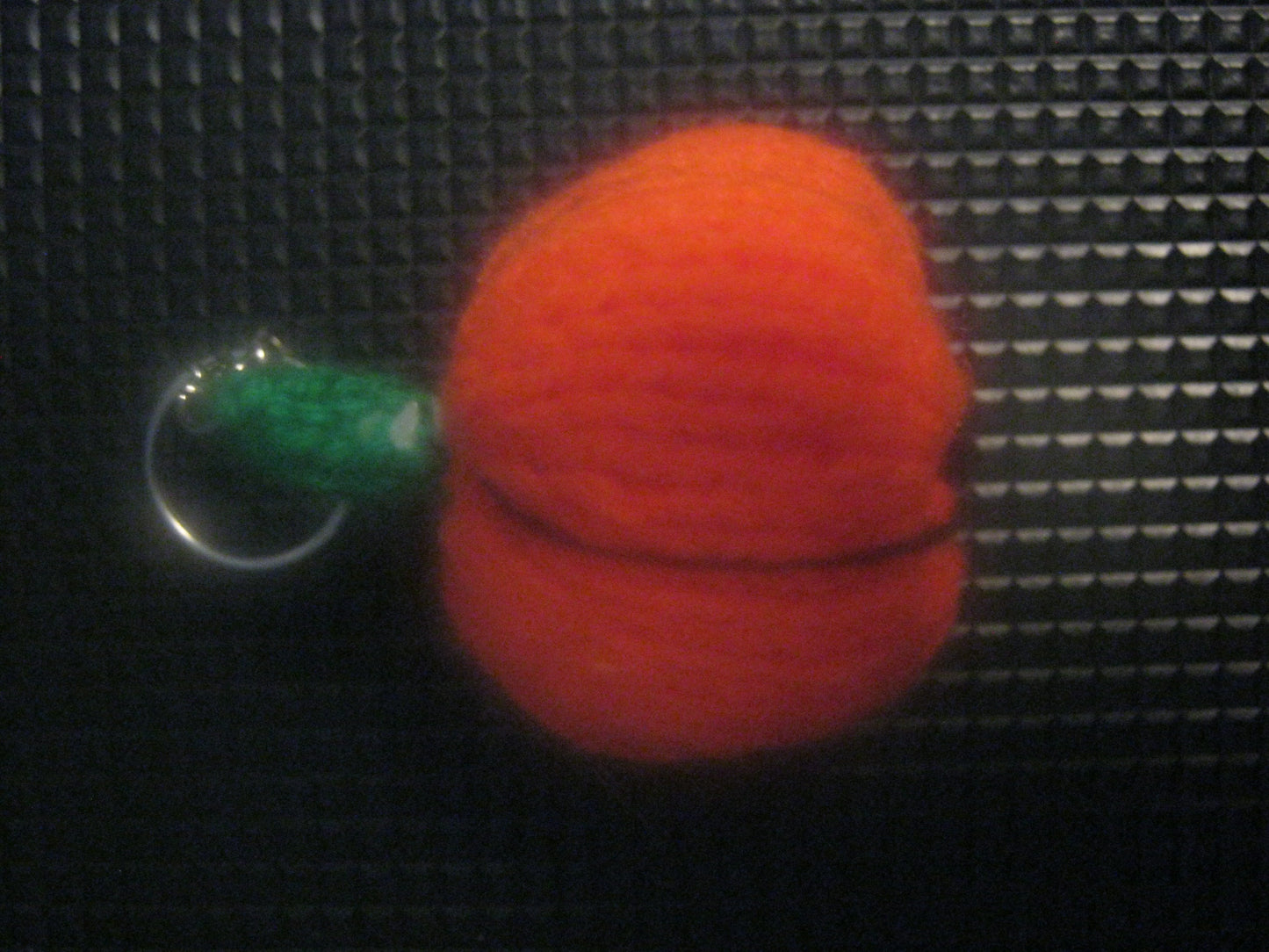 assortment of keyrings that are knitted or crocheted