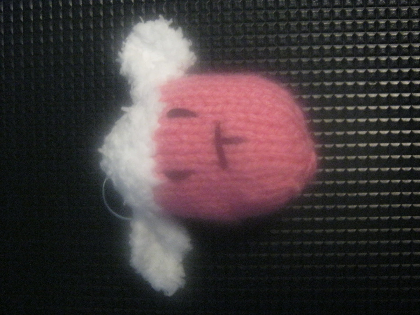 assortment of keyrings that are knitted or crocheted