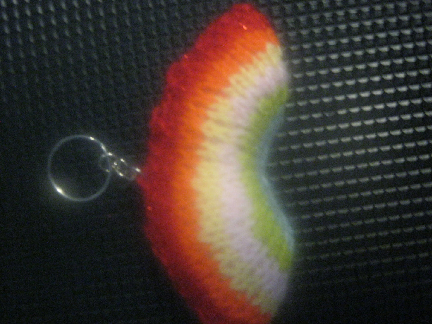 assortment of keyrings that are knitted or crocheted