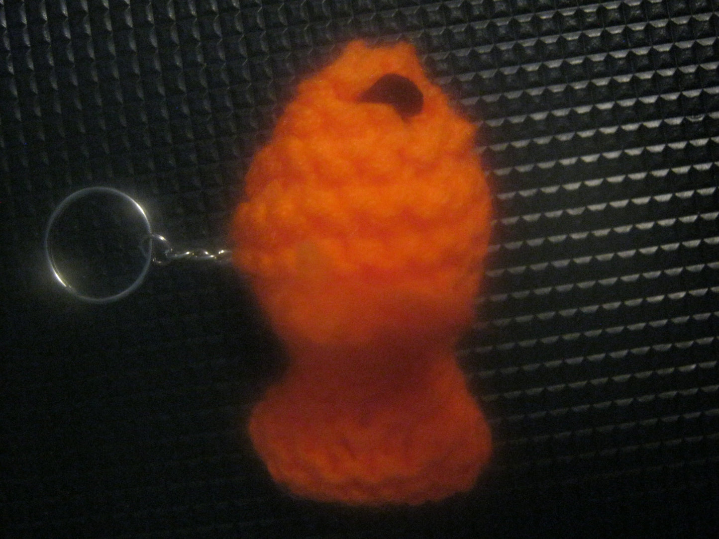assortment of keyrings that are knitted or crocheted