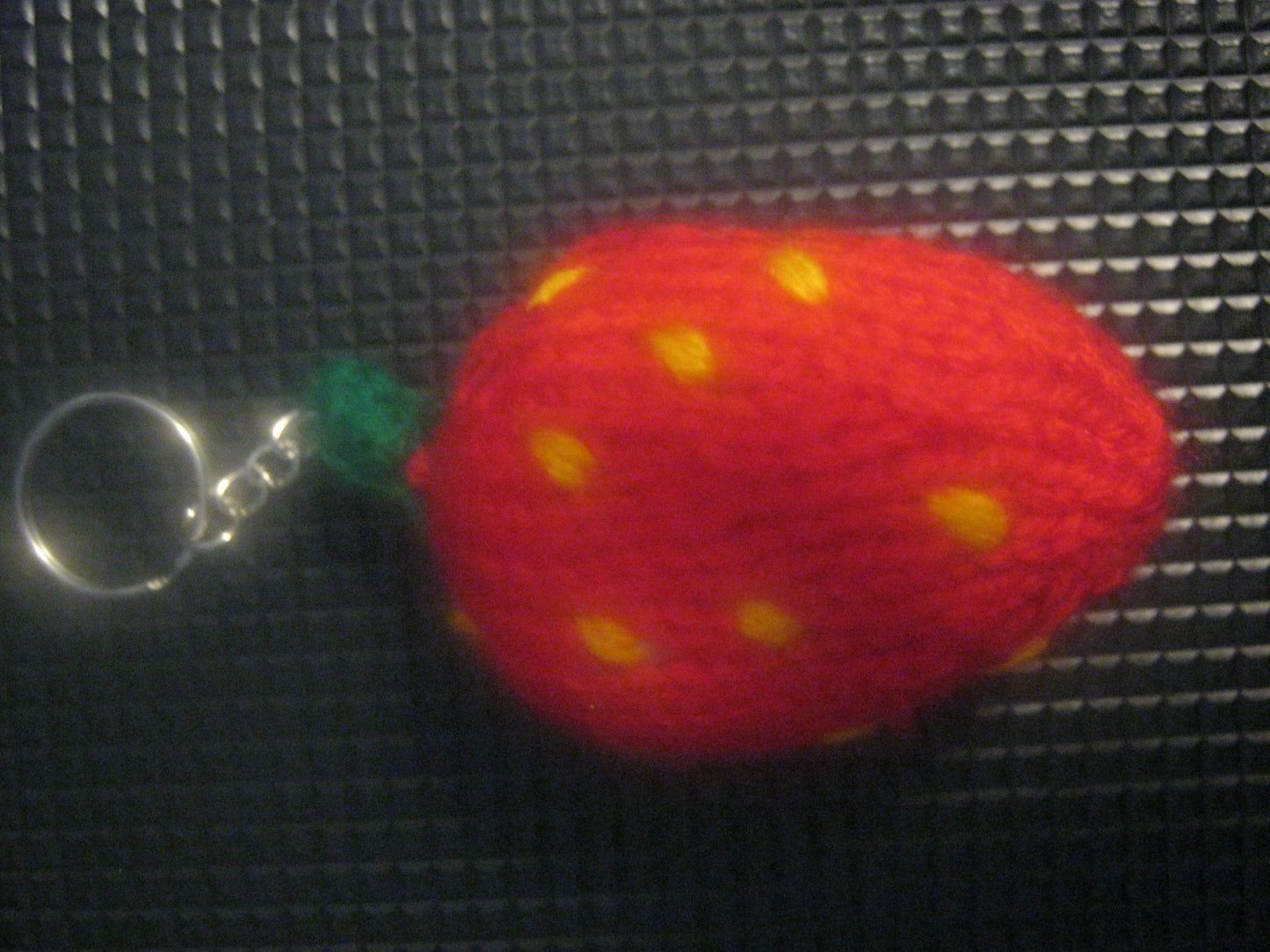 assortment of keyrings that are knitted or crocheted