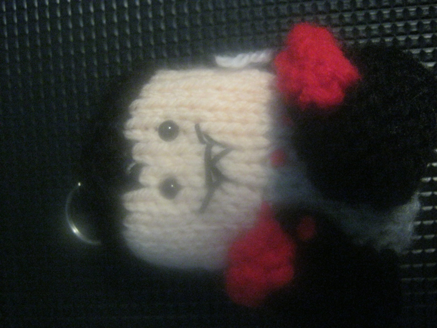assortment of keyrings that are knitted or crocheted