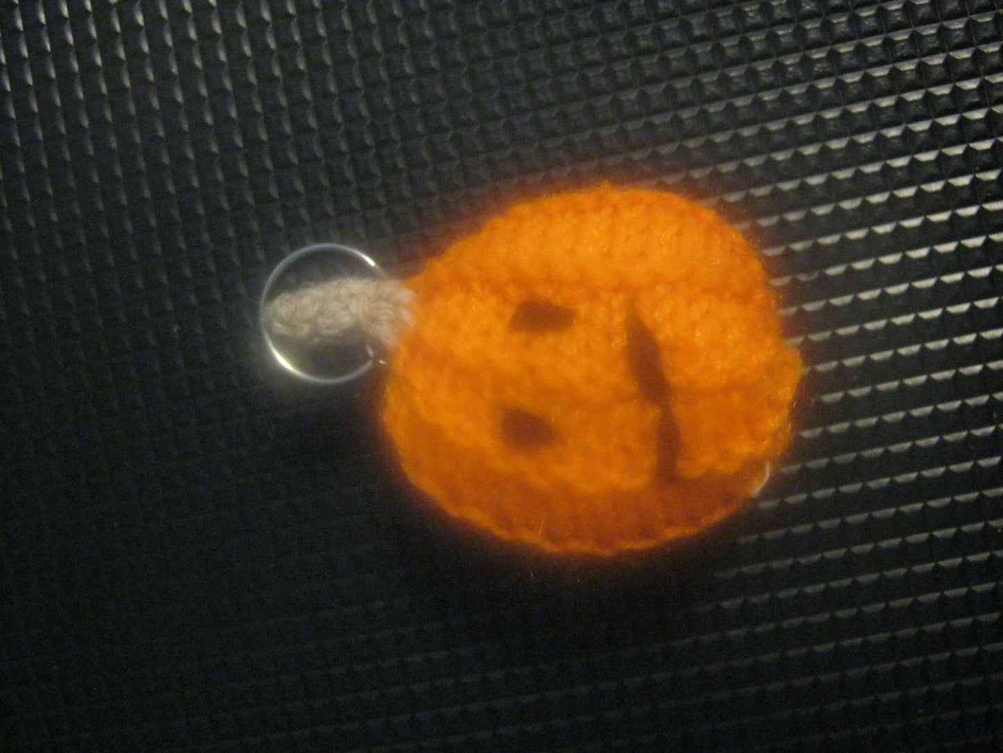 assortment of keyrings that are knitted or crocheted