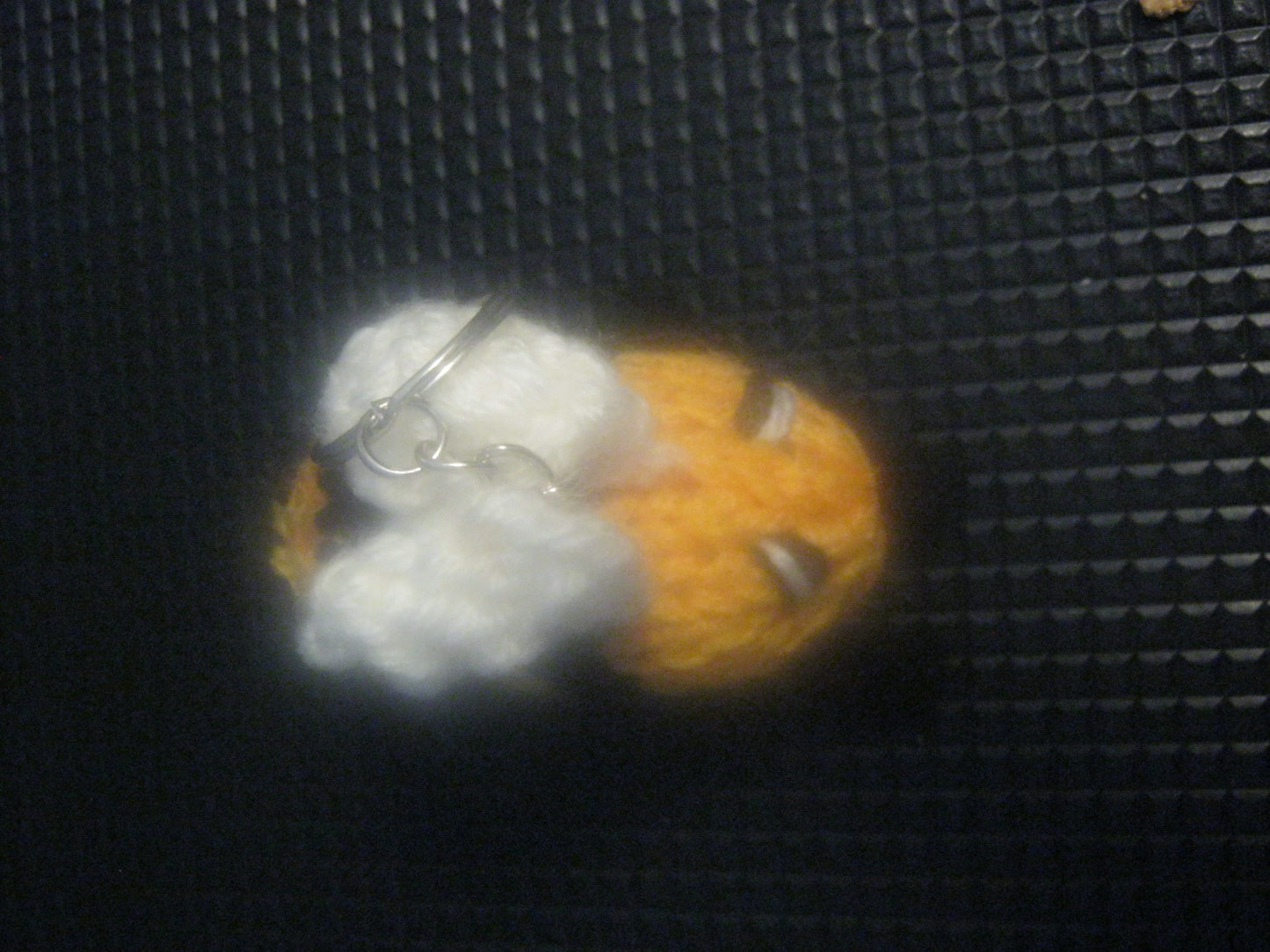 assortment of keyrings that are knitted or crocheted