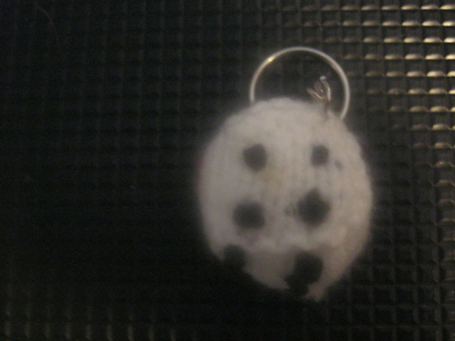 assortment of keyrings that are knitted or crocheted