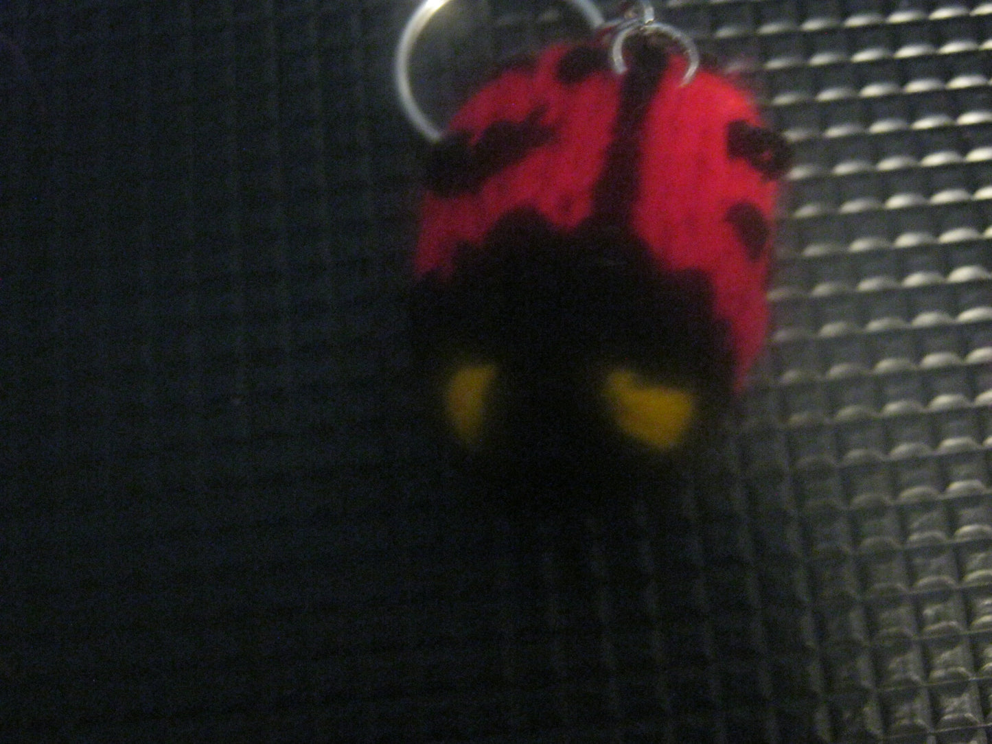 assortment of keyrings that are knitted or crocheted