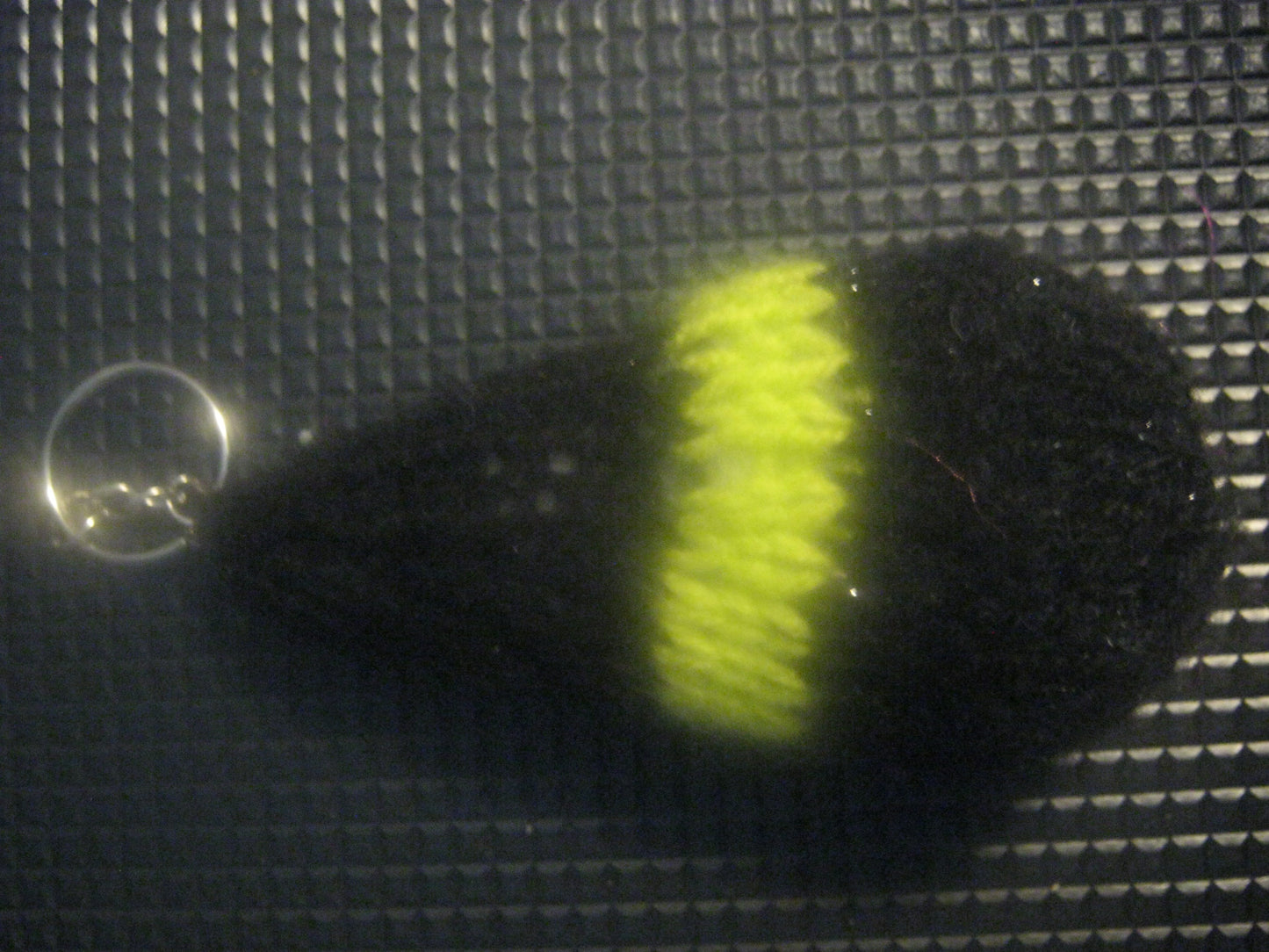 assortment of keyrings that are knitted or crocheted