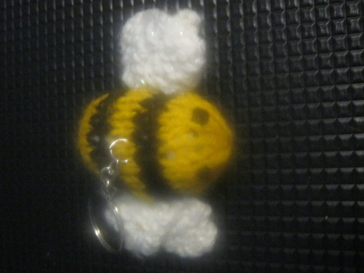 assortment of keyrings that are knitted or crocheted