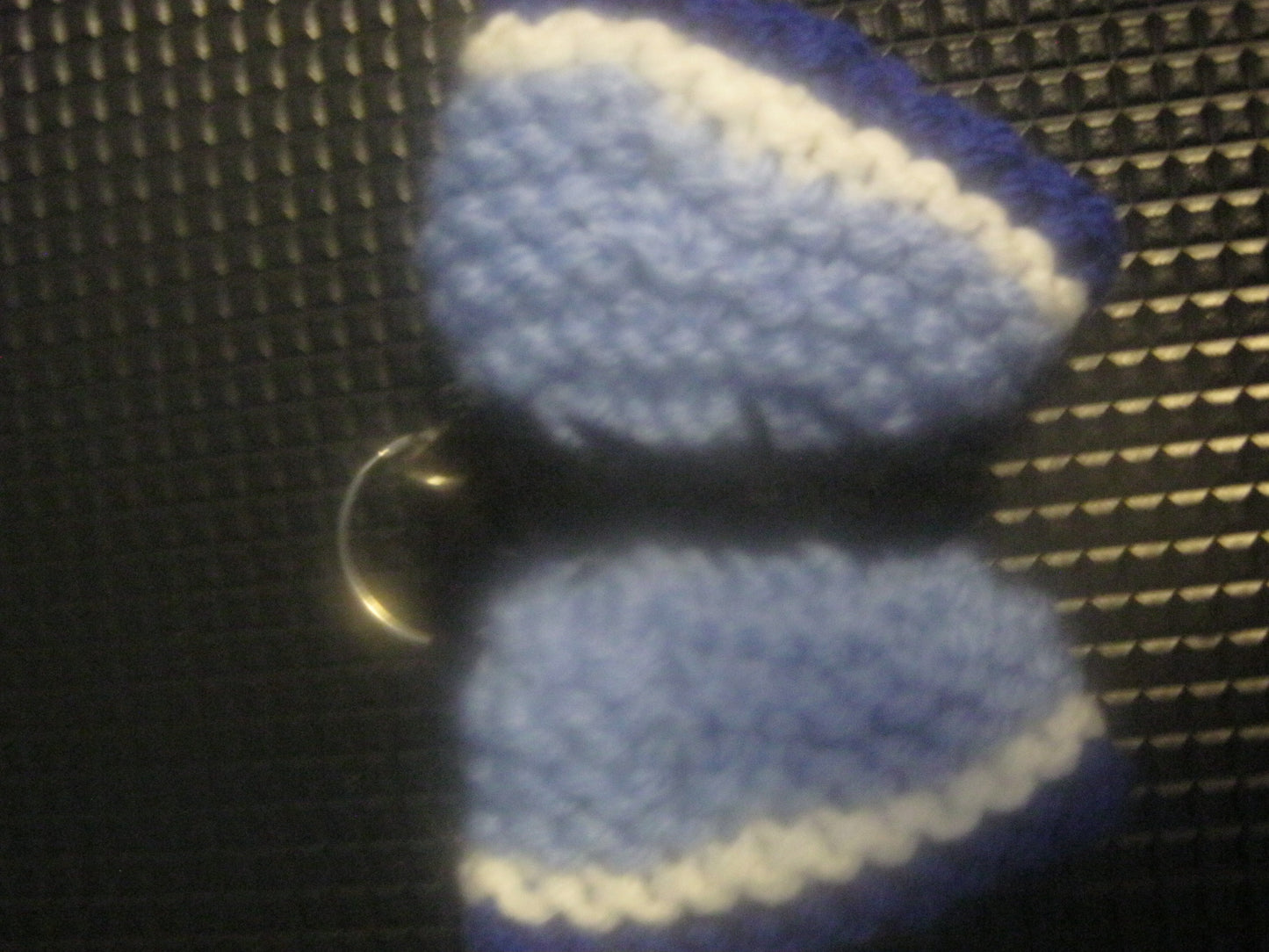 assortment of keyrings that are knitted or crocheted