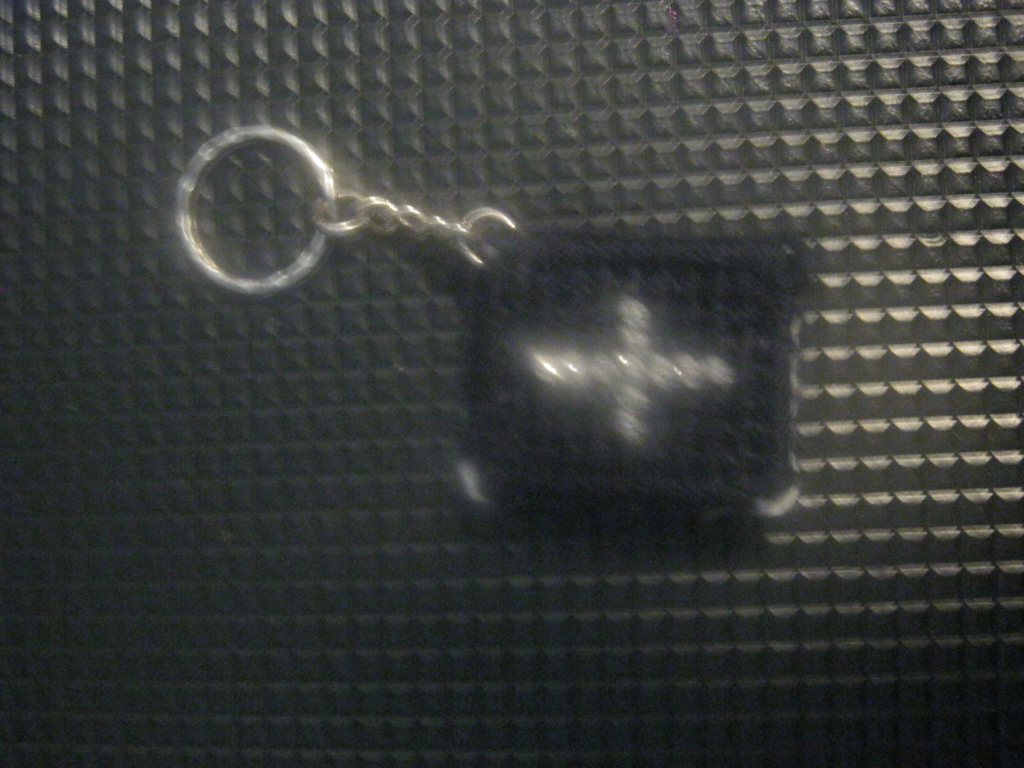 assortment of keyrings that are knitted or crocheted
