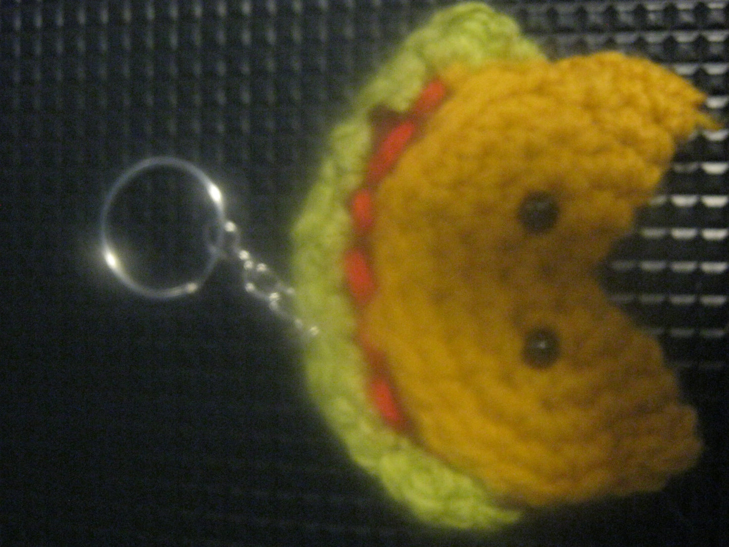 assortment of keyrings that are knitted or crocheted