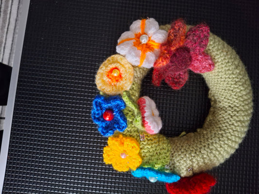 Floral knitted and crocheted wreath