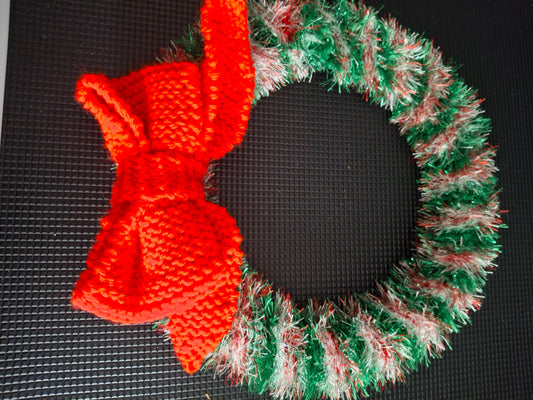 Christmas wreath knitted with knitted bow
