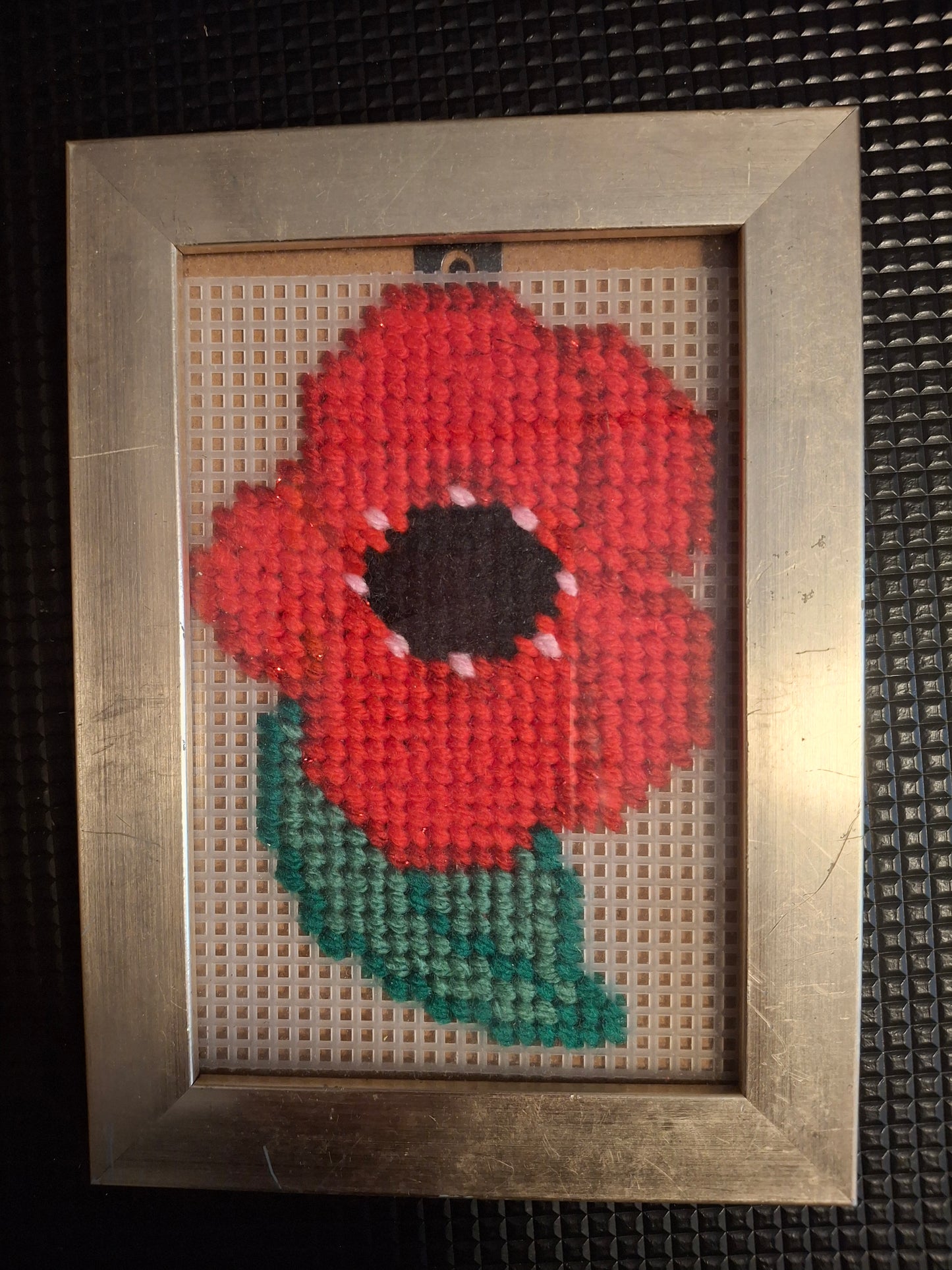 Poppy design  cross stitched  in picture frame